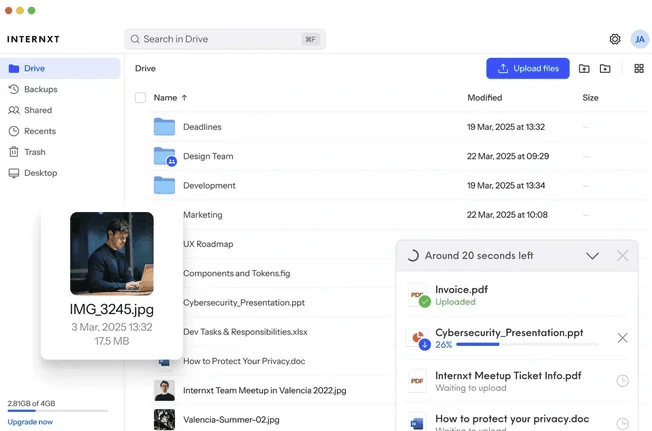 Internxt Drive web app with a file list, a photo preview and an upload progress panel